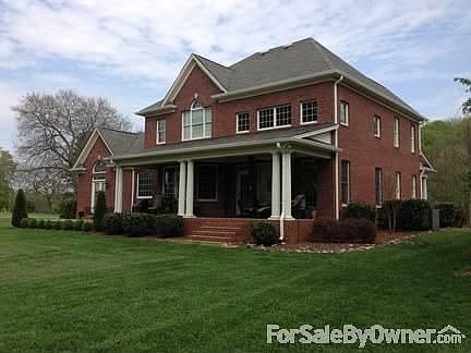 Rear View of House
						:
						Back Porch has Stamped concrete and is covered.