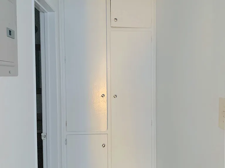 Tall hallway linen closets
