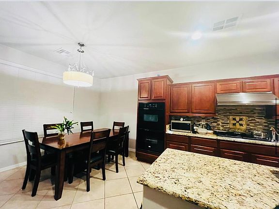 Gourmet Kitchen with Commercial Stove and Hood.