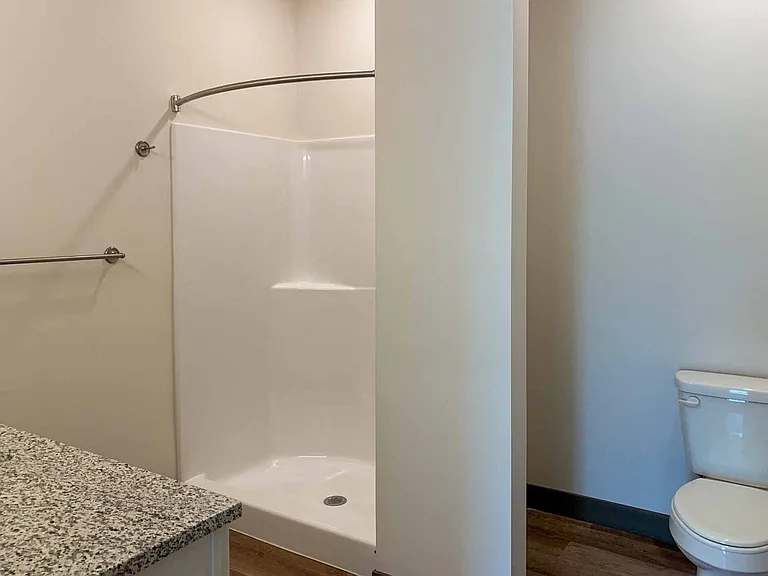 Our two-bedroom Travertine features a bathroom with a walk-in shower and the other with a tub