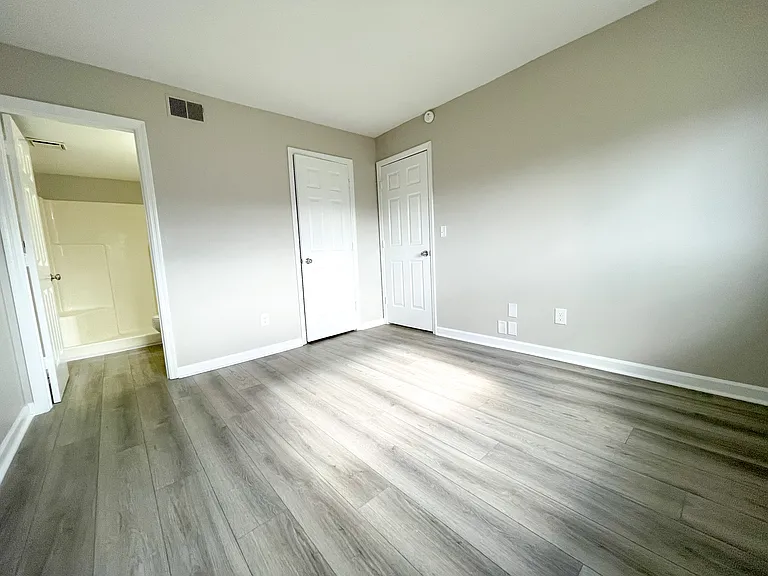 Master bedroom with attached Master Bathroom and walk-in closet.