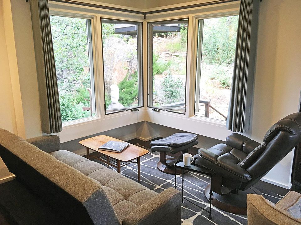 Living area looks out on backyard garden