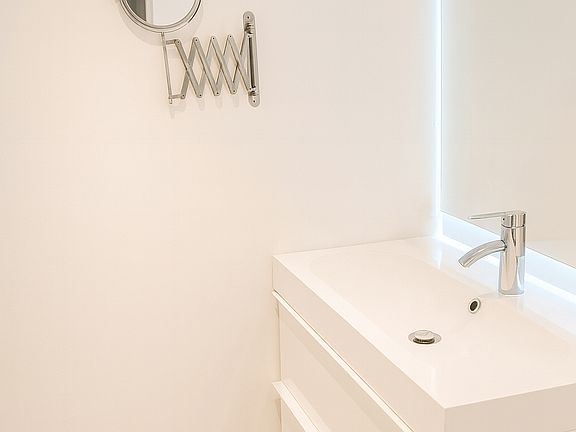 Guest toilet with Vanity and Mirror with Backlight.