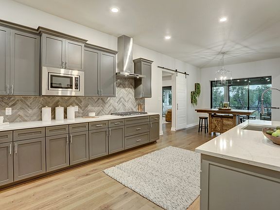The kitchen comes with beautiful wood cabinetry and stainless steel appliances.