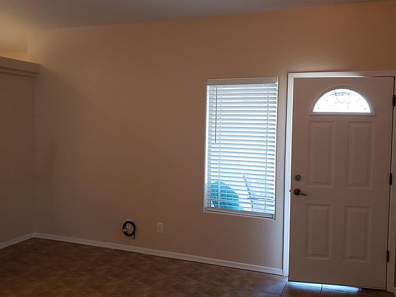 Tile floor main room, kitchen & baths. New lighting.