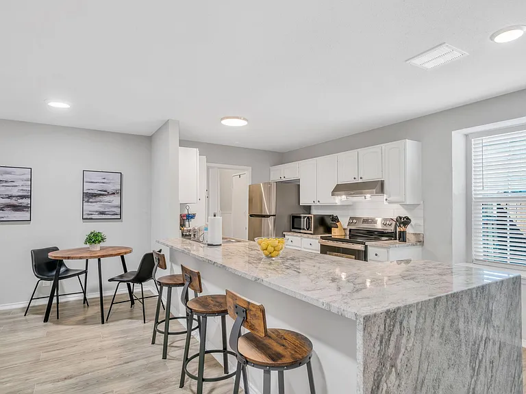 Oversized kitchen island with bar stools
