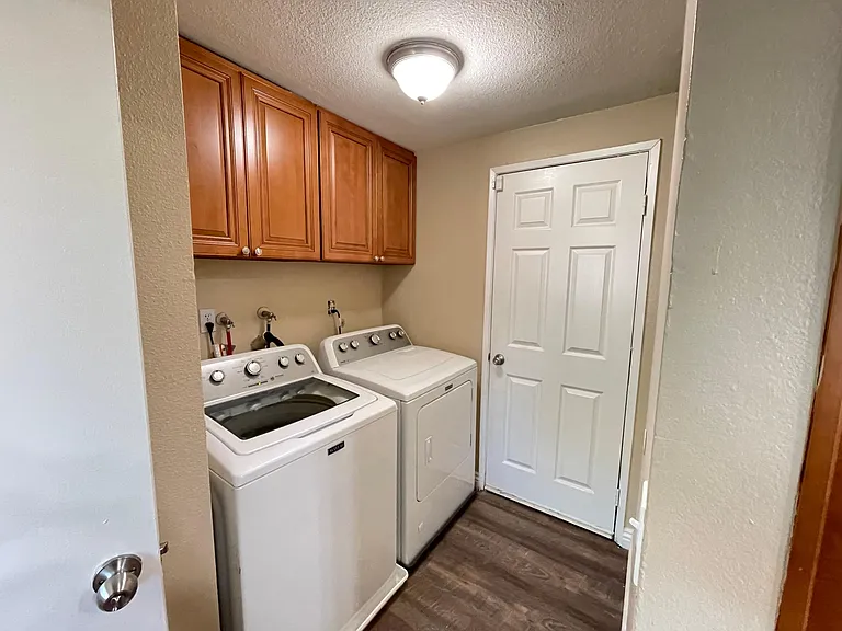 Downstairs - laundry and 3-car garage door access