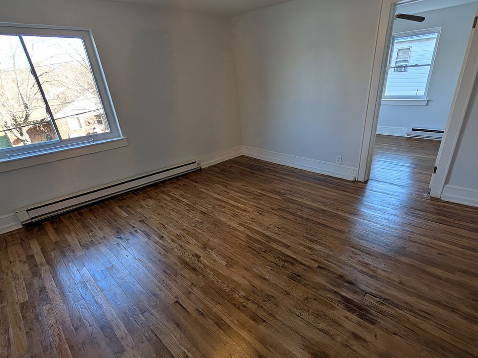 Living room (view from door) recently refinished oak hardwood floors and fresh paint