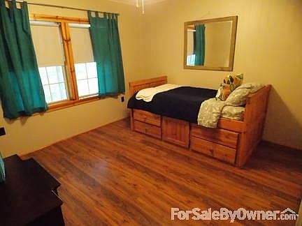 Guest Bedroom : Has a sliding door closet and new laminate wood flooring