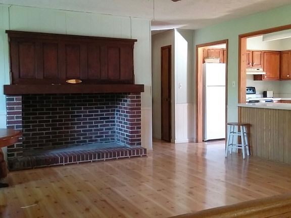 Dining area with big hearth.