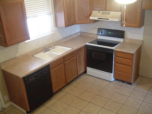 Remodeled Kitchen with new paint, countertops, and tile