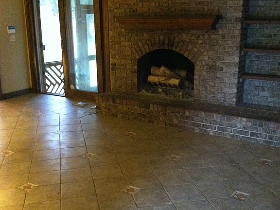 Den leading to back porch and kitchen