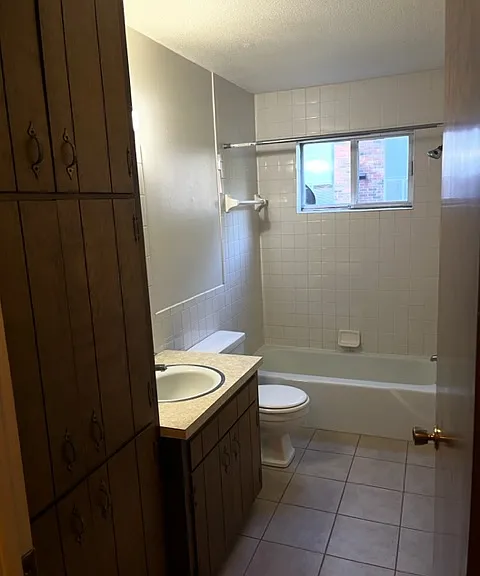 Bathroom with attached shower and linen closet