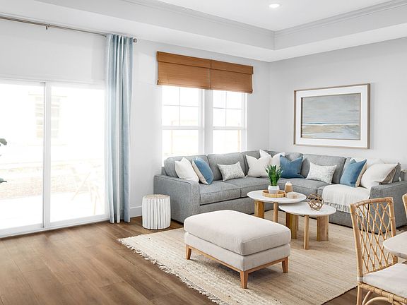 Great room with coffered ceiling and crown moulding