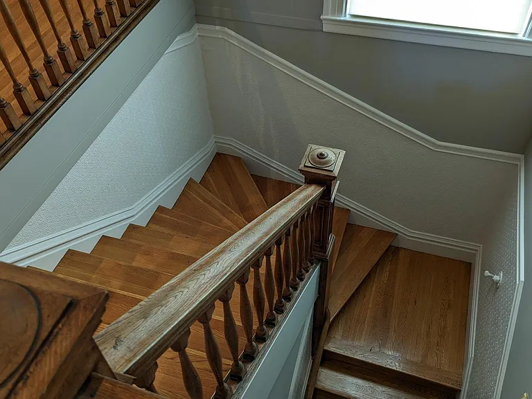 Stairs looking down from the foyer.