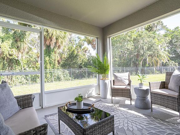 Your interior opens to a screened lanai, with the privacy of no left side or backyard neighbors.