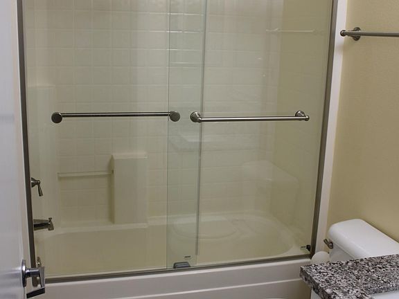 Barn door style glass shower doors