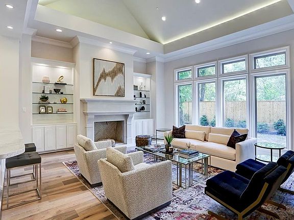 Large formal dining room has a groin ceiling. Notice the beautiful floating staircase and the wine room.