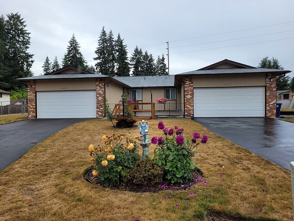 Front of Duplex 10610 109th ST SW. That has 2 beds, sunroom, 2 baths and 2 car garage