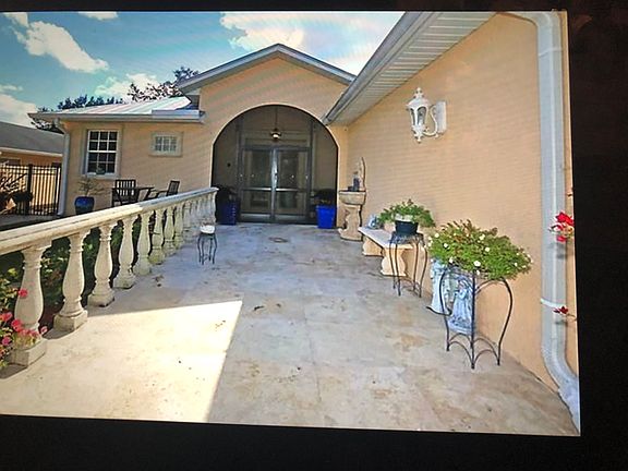 Travertine walkway to house