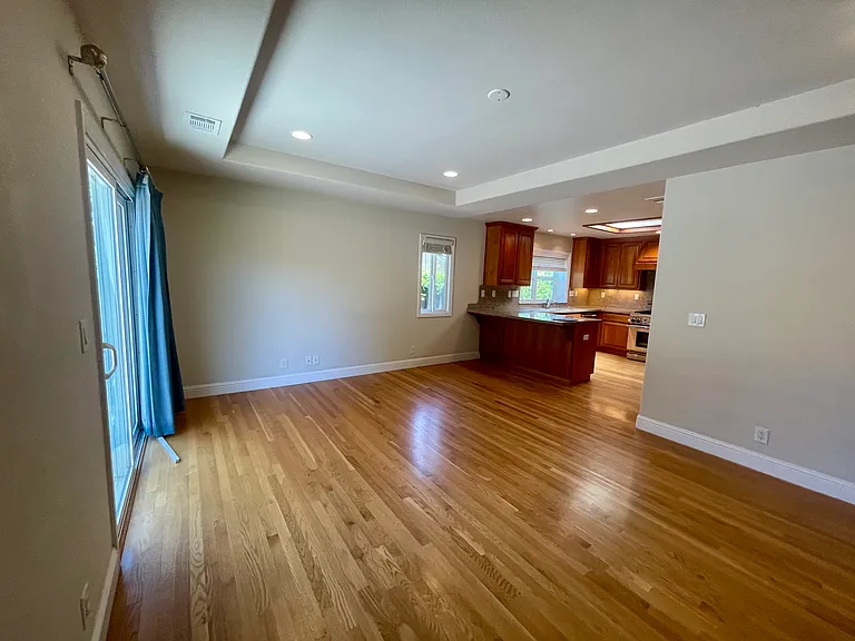 Dining & Family Room-A chic peninsula island bridges the Kitchen and Dining & Family room, creating the perfect hub for open-concept entertaining.