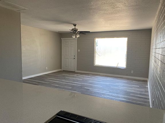 Living room view from kitchen, great for entertaining, new fan, new window