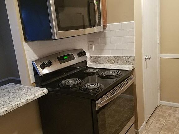 Beautiful and new stainless steel stove and microwave
