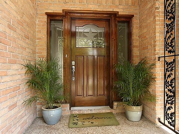 Walk through this custom door system for a tour of this extensively renovated home