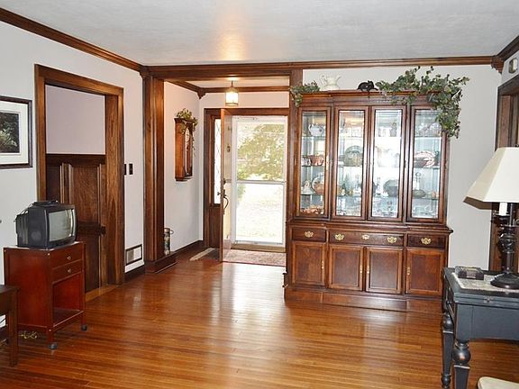 Entry way with small foyer is lovely. Note Custom Wood Trim.
