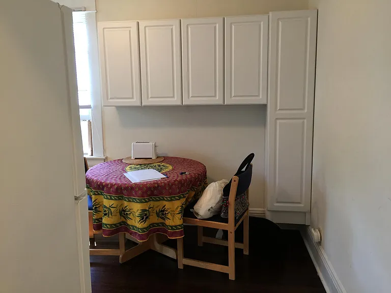 cabinets, table and chairs looking into the kitchen