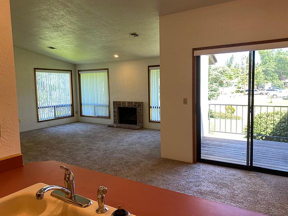 Living room, dining area and deck as seen from the kitchen,