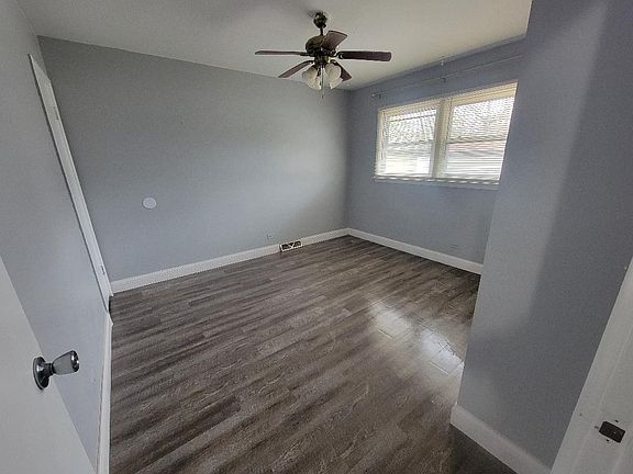 master bedroom with a half bathroom