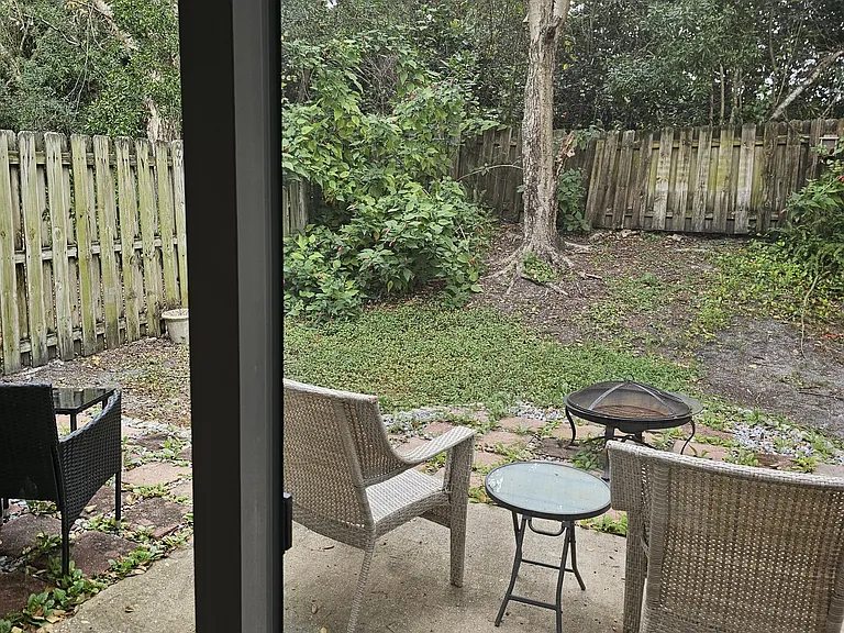 Sliding door from kitchen to back yard. A new fence is being installed on June 9, 2026