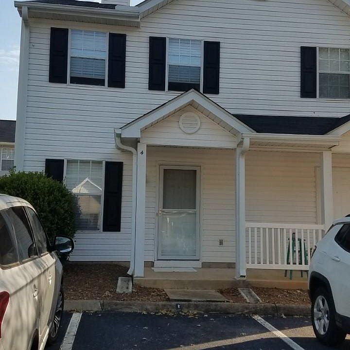 Two parking spaces to the left of the townhome - they are marked #4