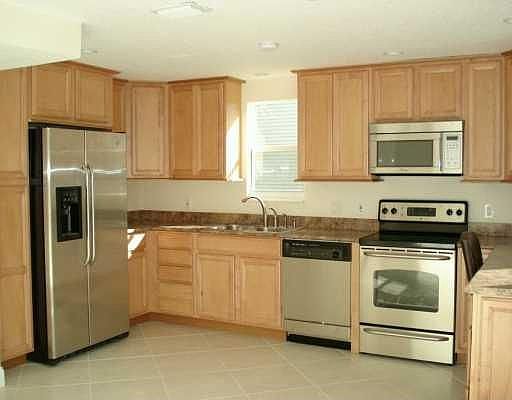 Totally redone kitchen with custom maple cabinetery, pantry, built in desk.