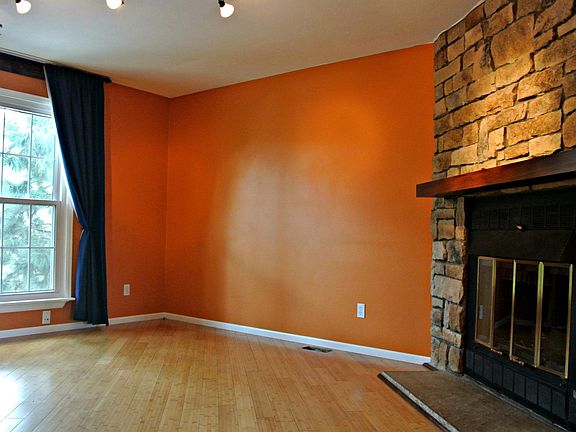 Living room with wood burning fire place