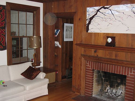 Living room, window looking to enclosed patio, entry to office