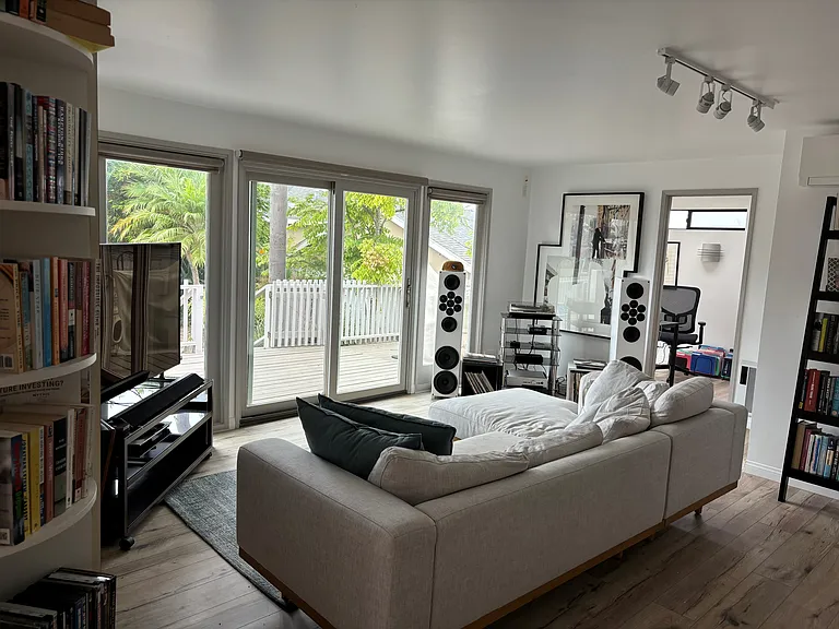 Living Room. Bright and open with beautiful garden view.