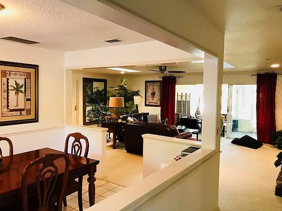 Entryway leads to living room ahead and dining room on the left, very open, spacious plan allows light to flood in
