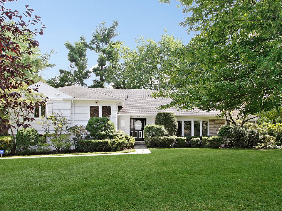 Clapboard and stone Split Level