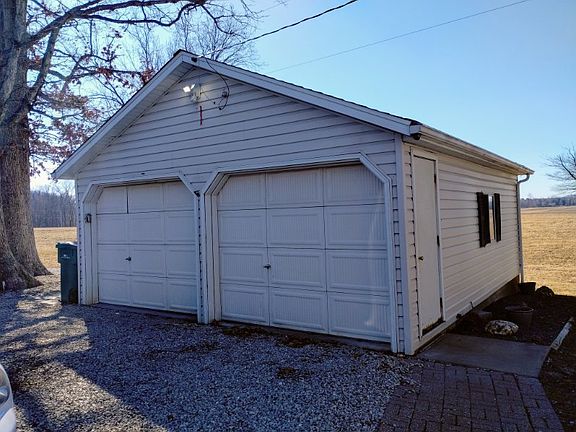 2 CAR GARAGE WITH NICE SIDEWALK LEADING TO IT.
