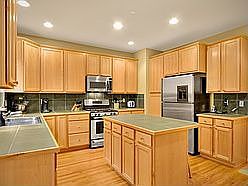 Gourmet kitchen with gas cooking, center island, harwoods...
