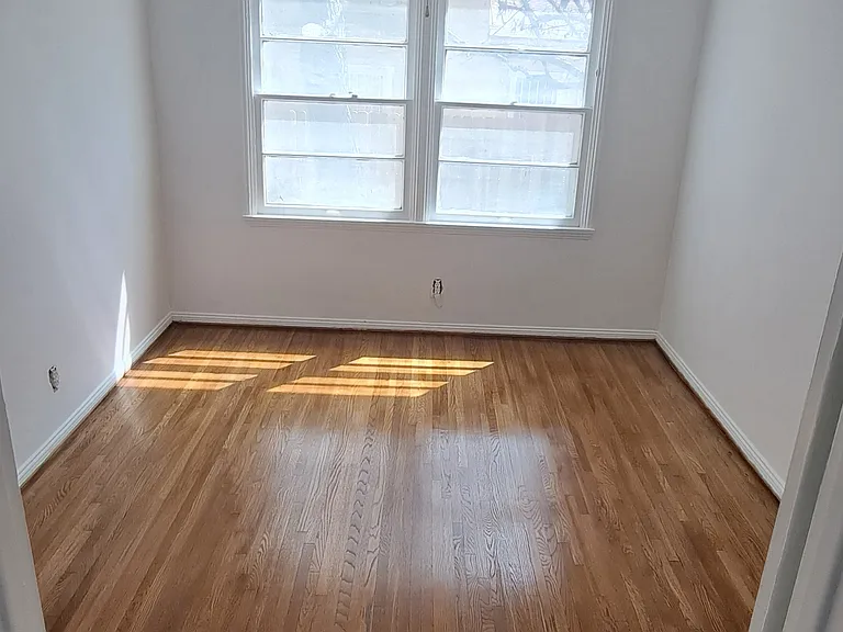 10'x13' Bedroom with ceiling fan, new curtains and window ac unit. New hardwood floors. 

Here is walk through video of the unit: