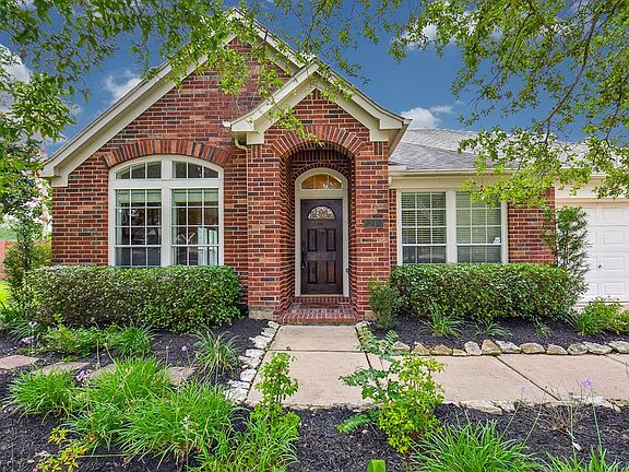 On a very large lot, this gorgeous home is truly inviting.