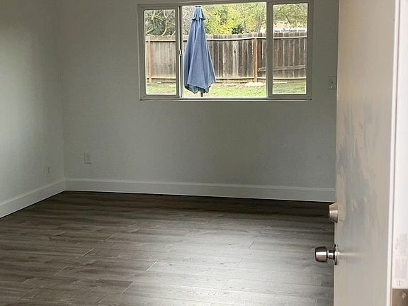 Spacious living room with 2 large windows