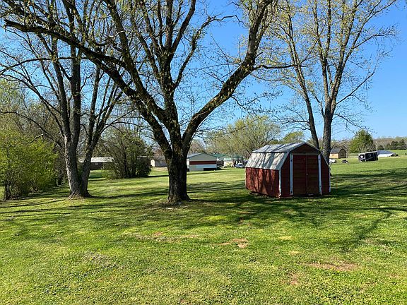 A storage shed for your convenience. This park like backyard covers a half an acre