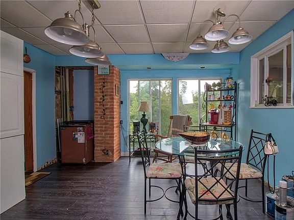 Cozy kitchen with large bay windows.