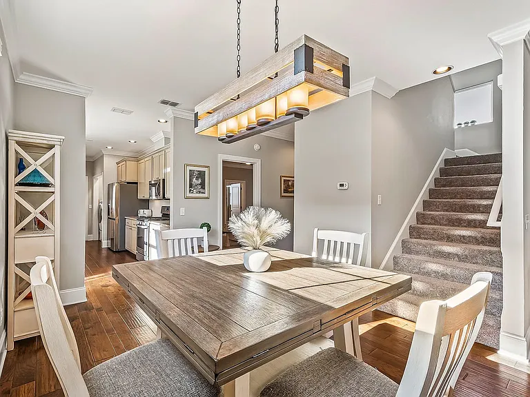 Dinning area, view to the kitchen, master bedroom and stairs to 2nd floor