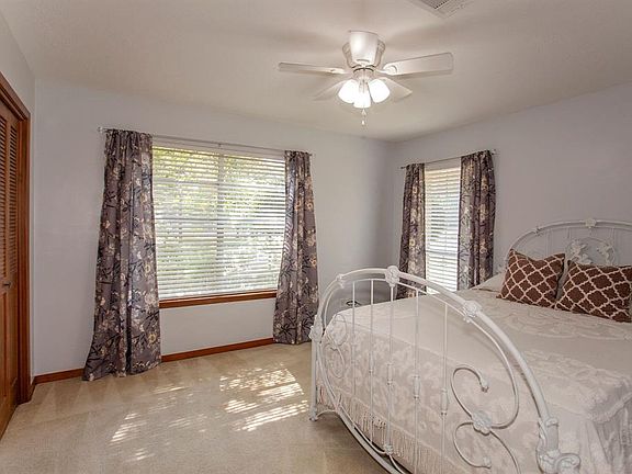 The 1st of two secondary bedrooms.