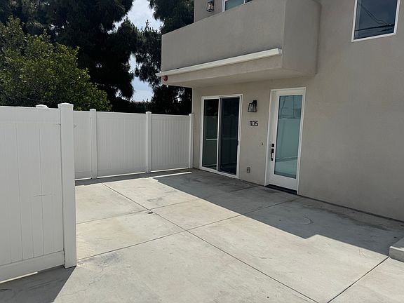 Inside the patio to your front door. Look at the room here. See above balcony off primary bedroom.